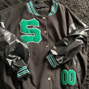 Green letterman’s jacket